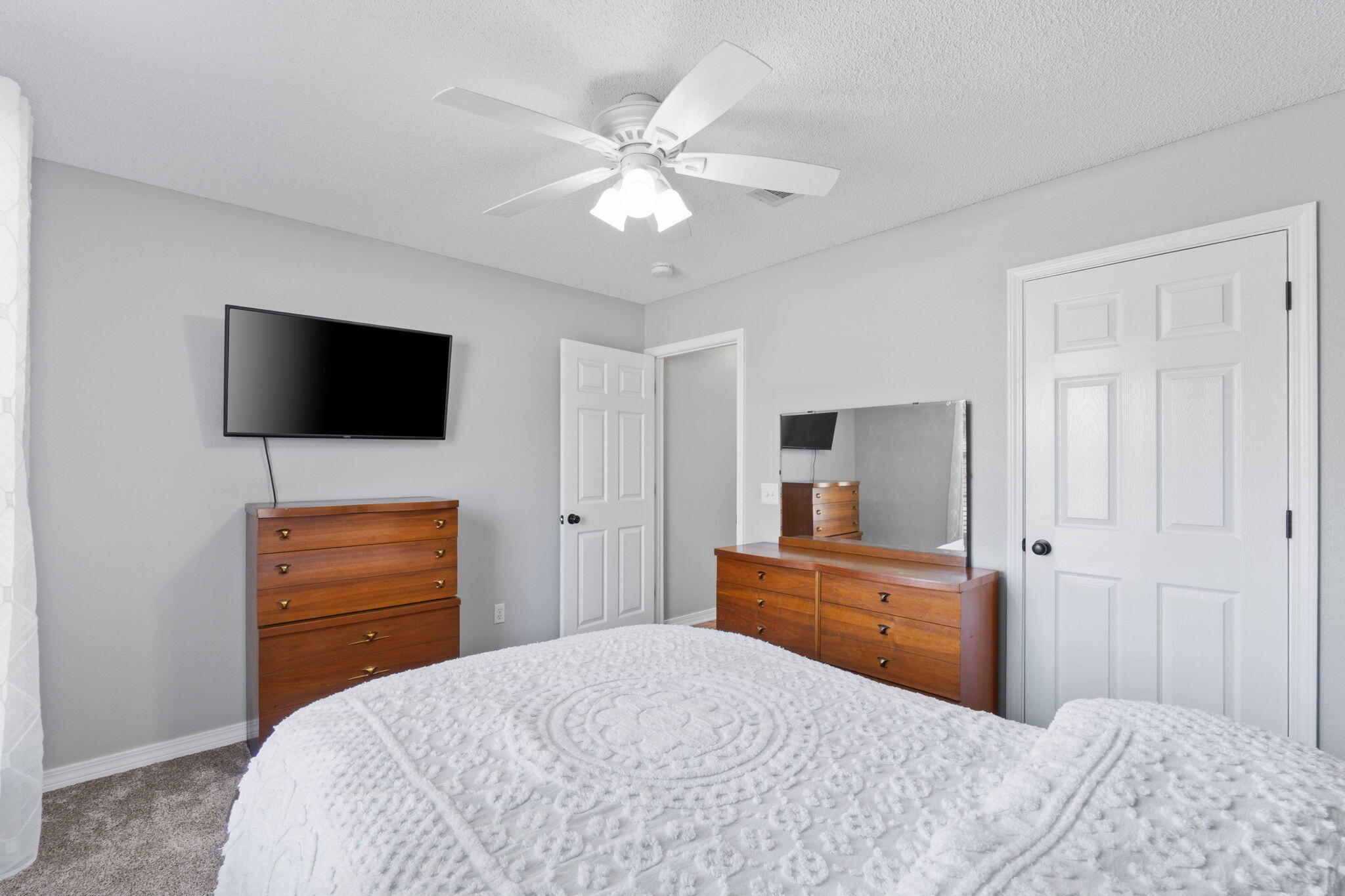 6779 Cedar Ridge Circle Milton, FL 32570 - Photo 27 of 46 a bedroom with a bed and a flat screen tv