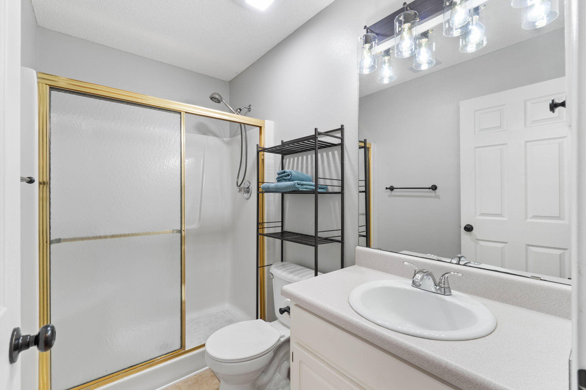 6779 Cedar Ridge Circle Milton, FL 32570 - Photo 28 of 46 a bathroom with a sink toilet and shower