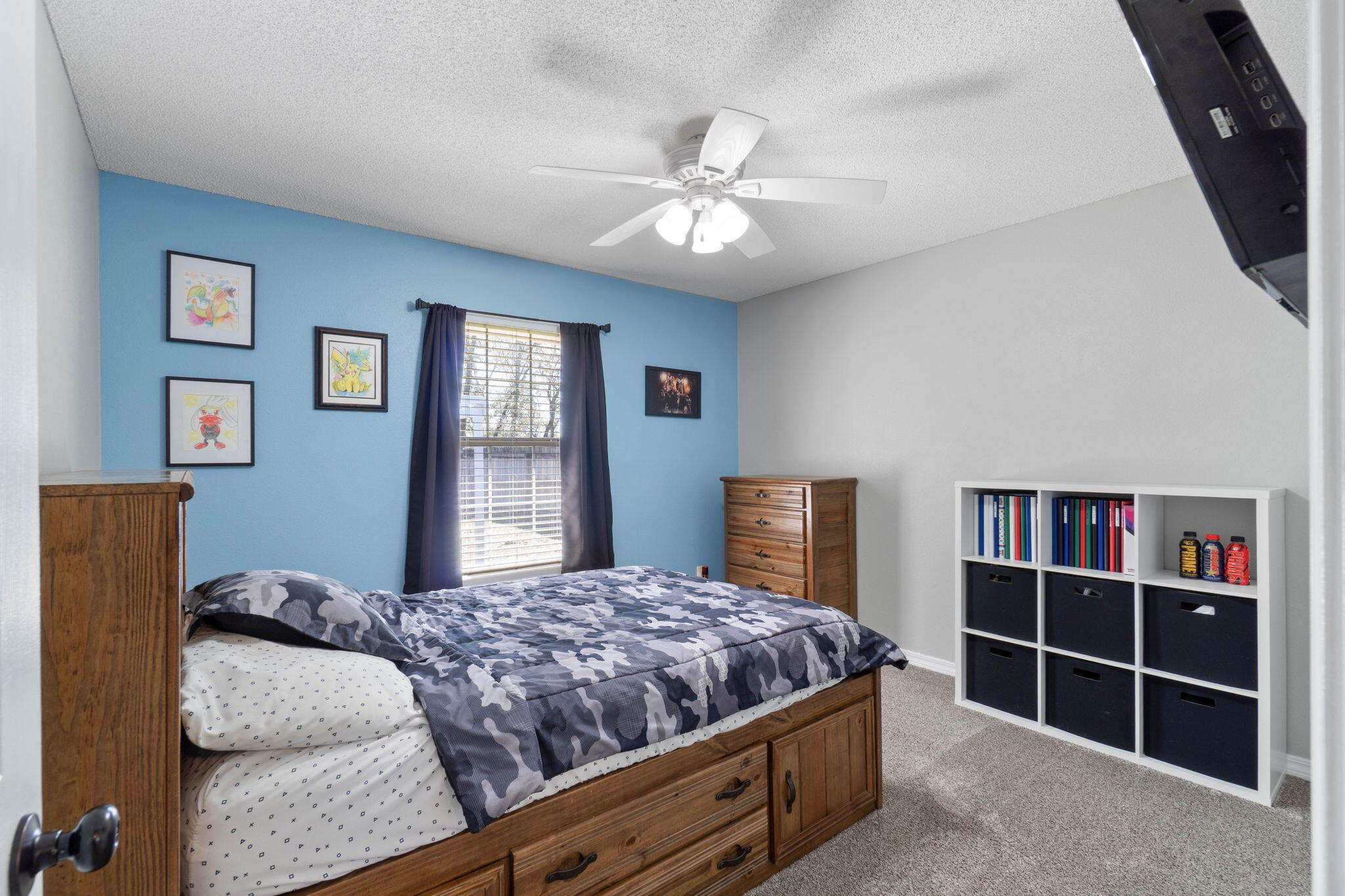 6779 Cedar Ridge Circle Milton, FL 32570 - Photo 29 of 46 a bedroom with a large bed and a chandelier