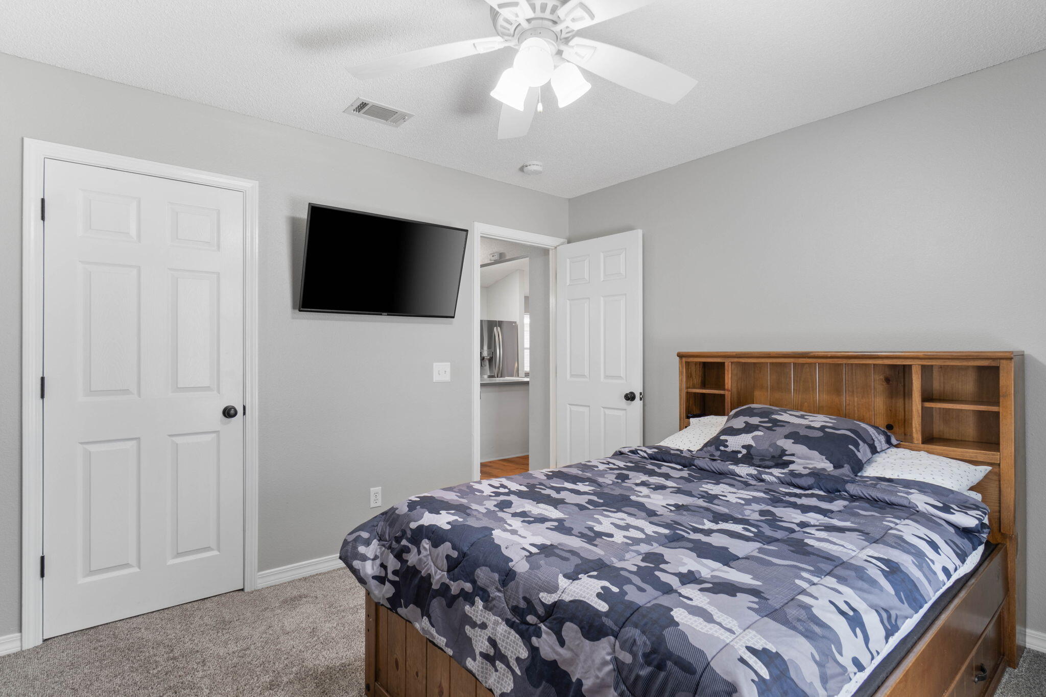 6779 Cedar Ridge Circle Milton, FL 32570 - Photo 30 of 46 a bedroom with a bed and a flat screen tv