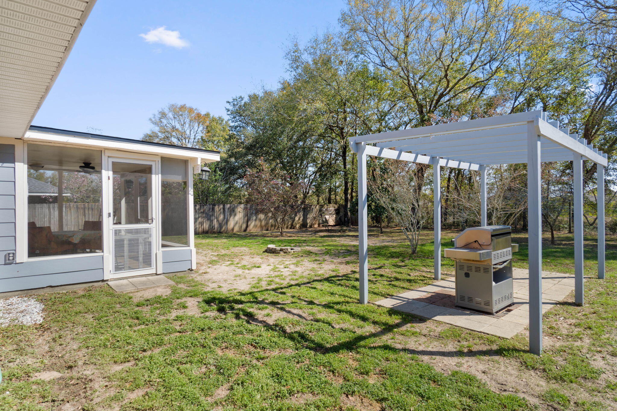 6779 Cedar Ridge Circle Milton, FL 32570 - Photo 32 of 46 a view of a house with backyard and porch