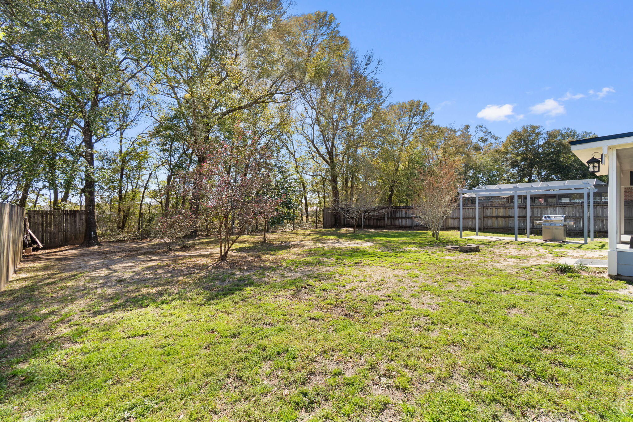 6779 Cedar Ridge Circle Milton, FL 32570 - Photo 34 of 46 a swimming pool with outdoor seating and yard