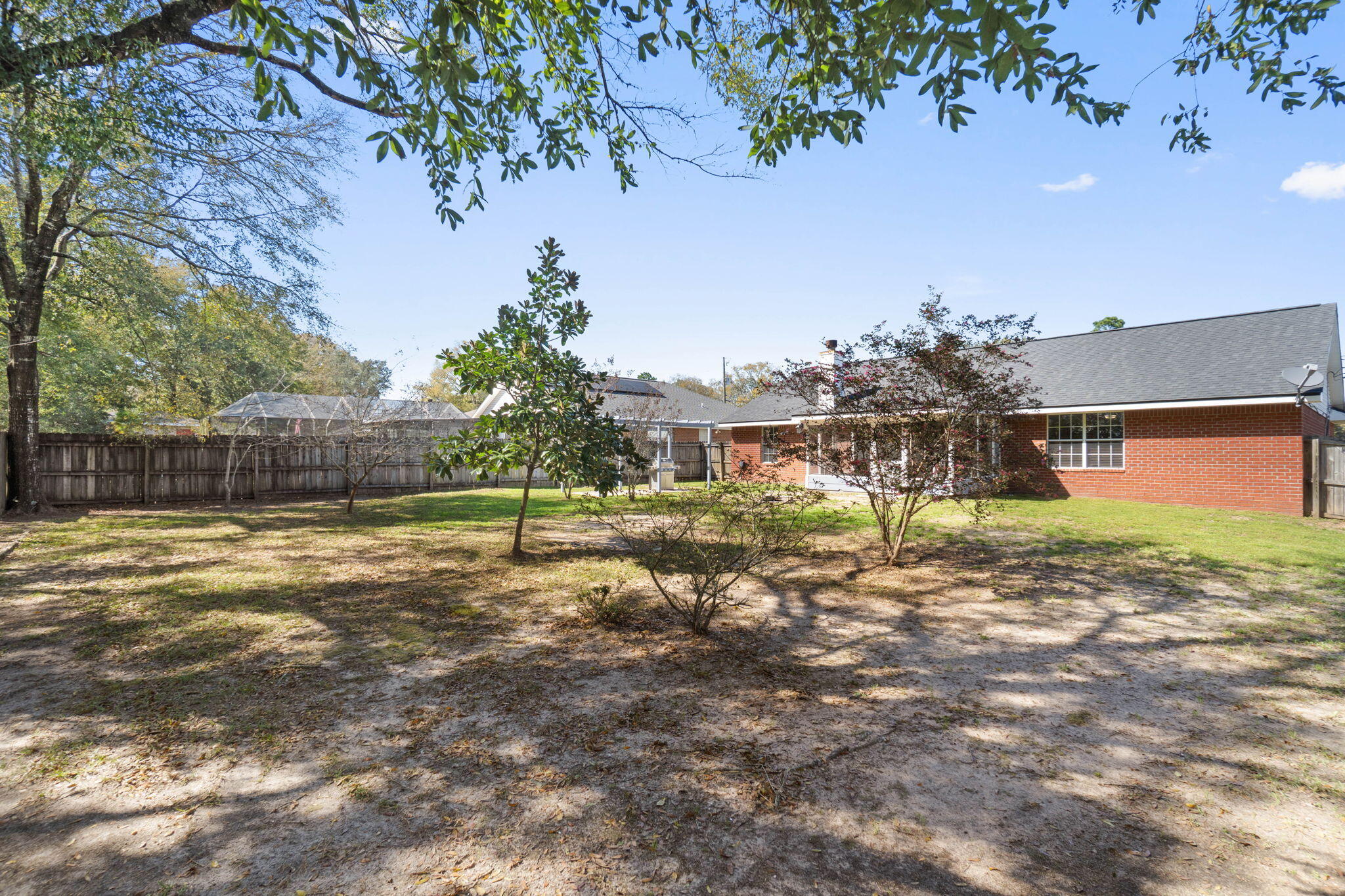 6779 Cedar Ridge Circle Milton, FL 32570 - Photo 35 of 46 a view of a yard with a house