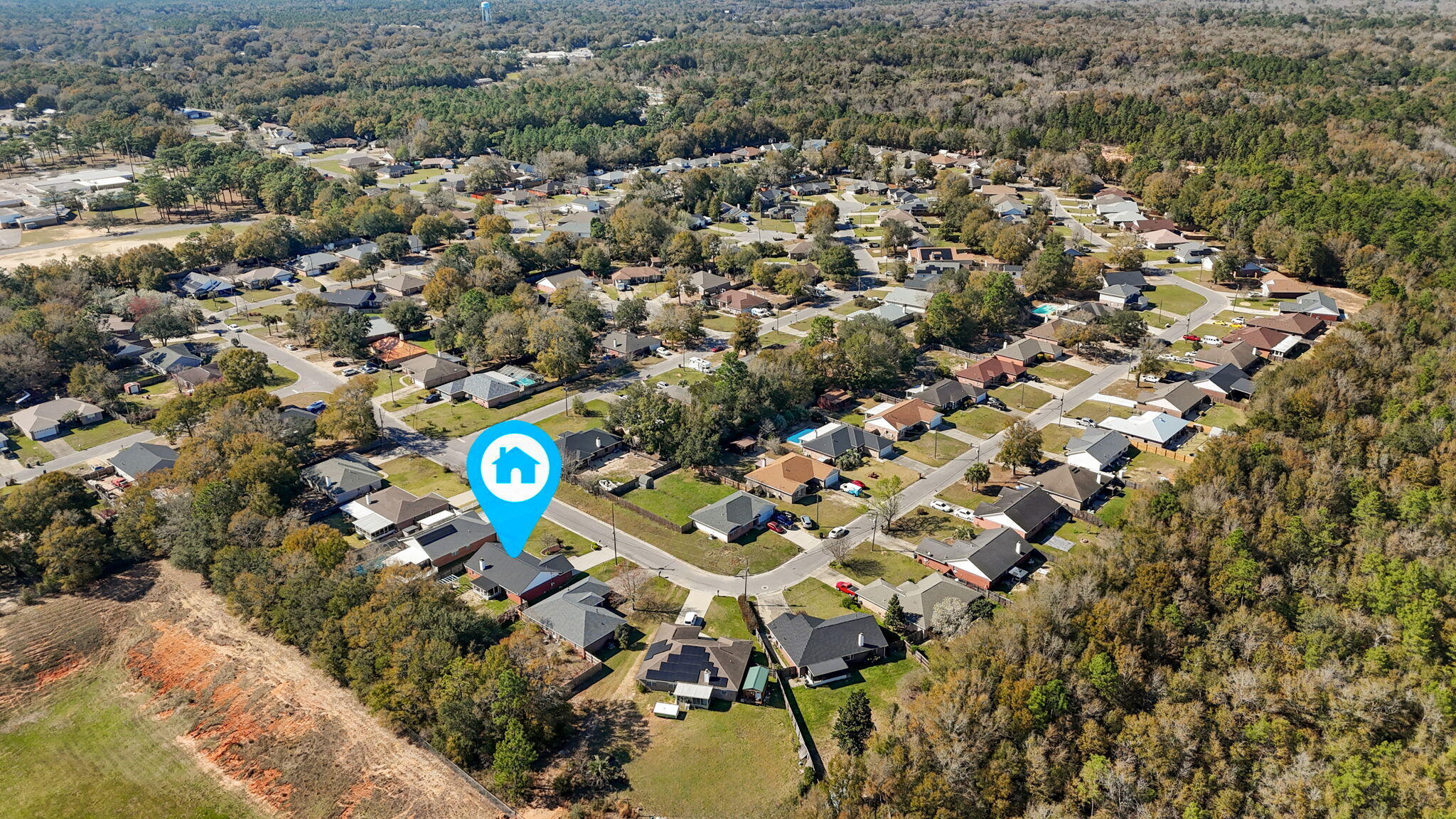 6779 Cedar Ridge Circle Milton, FL 32570 - Photo 39 of 46 an aerial view of a house with a swimming pool