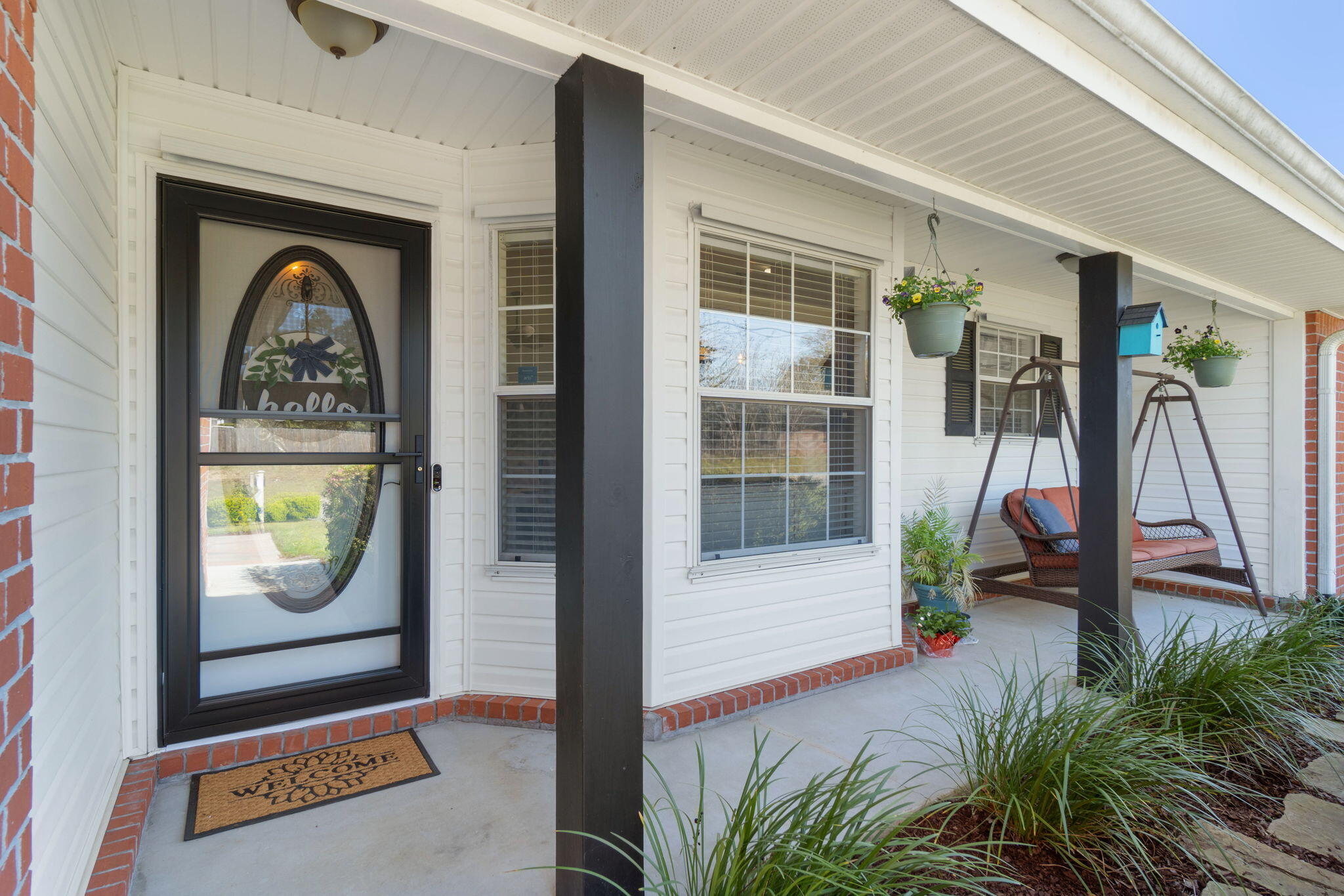 6779 Cedar Ridge Circle Milton, FL 32570 - Photo 5 of 46 a front view of a house with garden