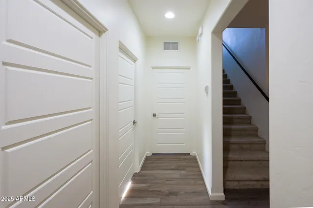 a view of a hallway with stairs