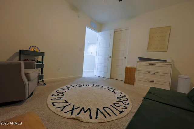 a bedroom with furniture and a window