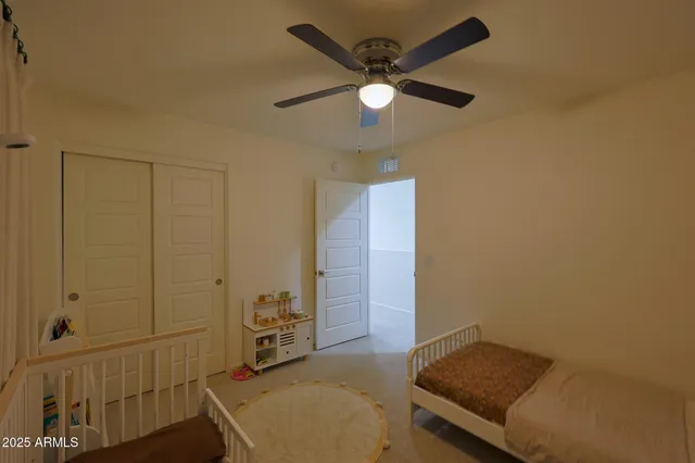 a bathroom with a double vanity sink toilet and a mirror