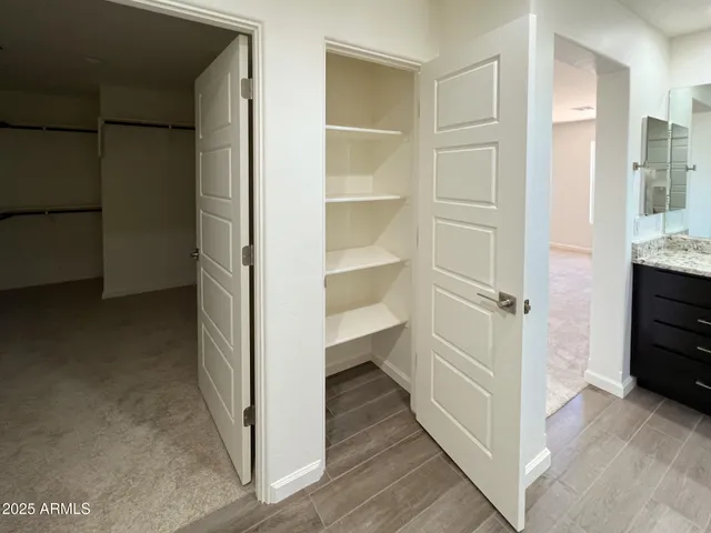 a bathroom with a toilet and vanity