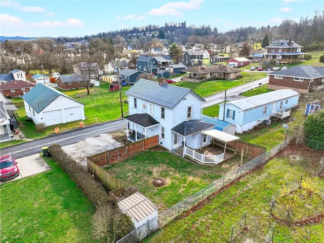 an aerial view of a house with a garden