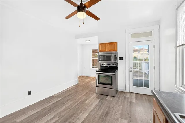 a view of kitchen with microwave and stove