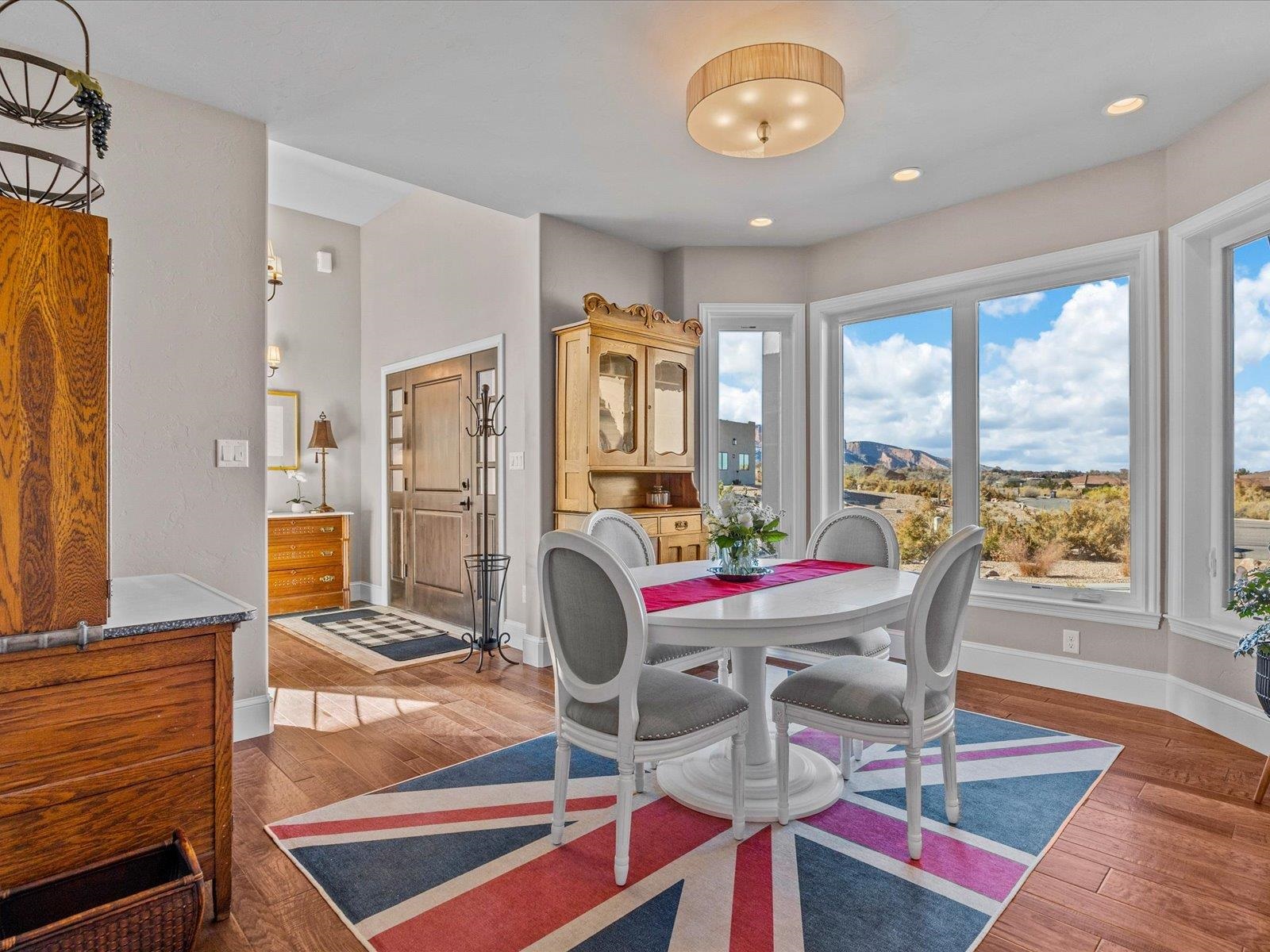 482 Riggs Way Grand Junction, CO 81507 - Photo 11 of 42 a view of a dining room with furniture a chandelier and wooden floor