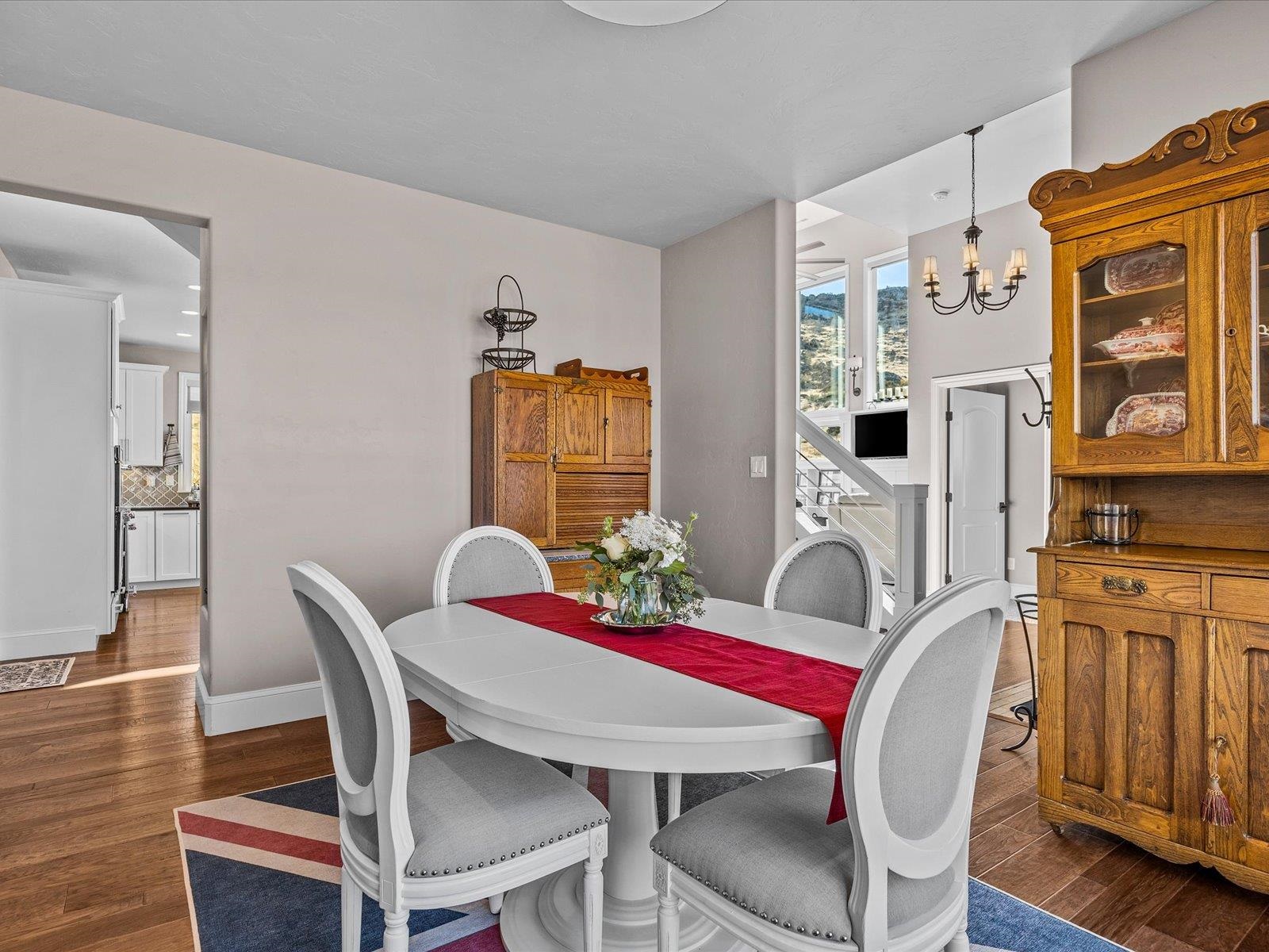 482 Riggs Way Grand Junction, CO 81507 - Photo 12 of 42 a view of a dining room with furniture window and wooden floor