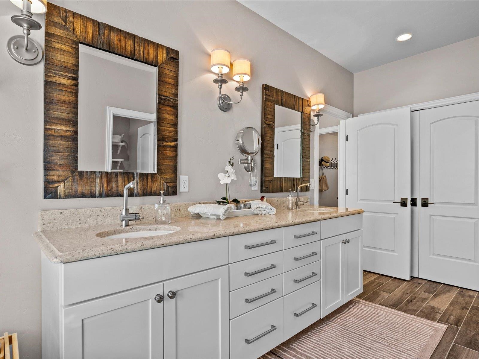 482 Riggs Way Grand Junction, CO 81507 - Photo 17 of 42 a bathroom with a granite countertop double vanity sink mirror and