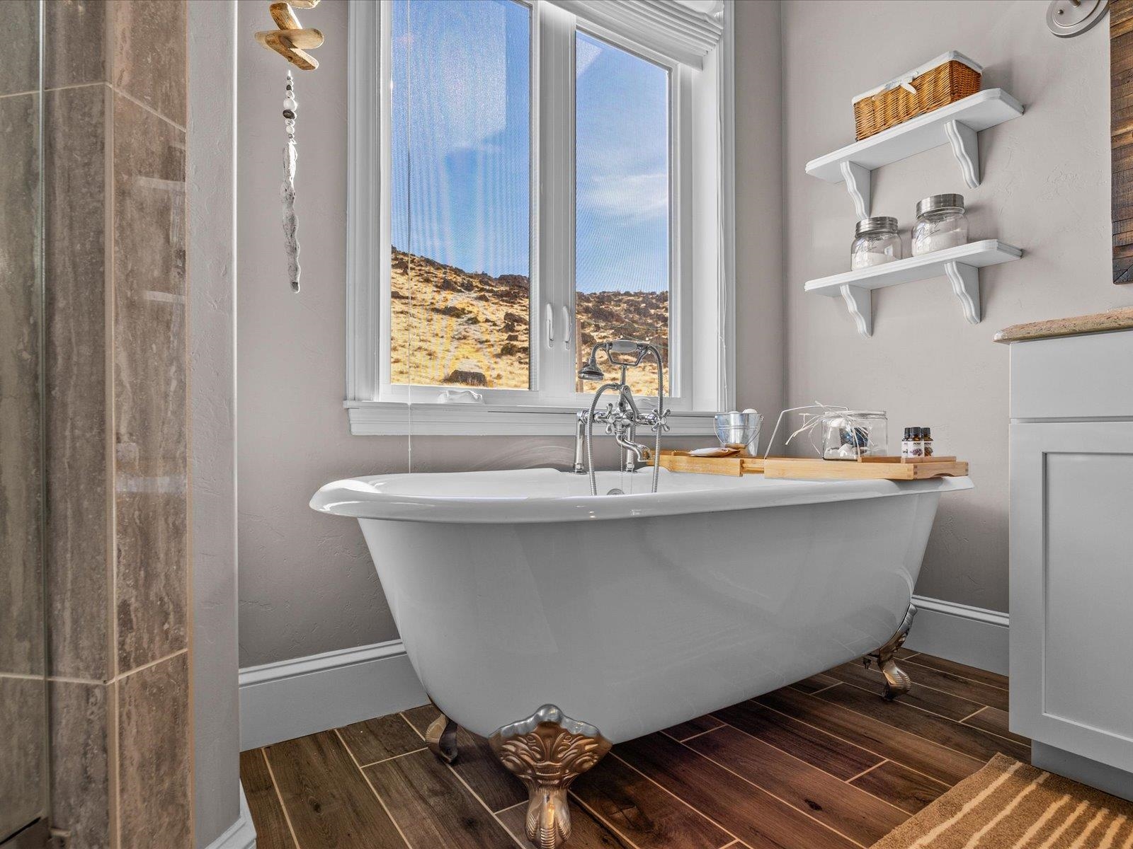 482 Riggs Way Grand Junction, CO 81507 - Photo 18 of 42 a white bath tub sitting next to a window