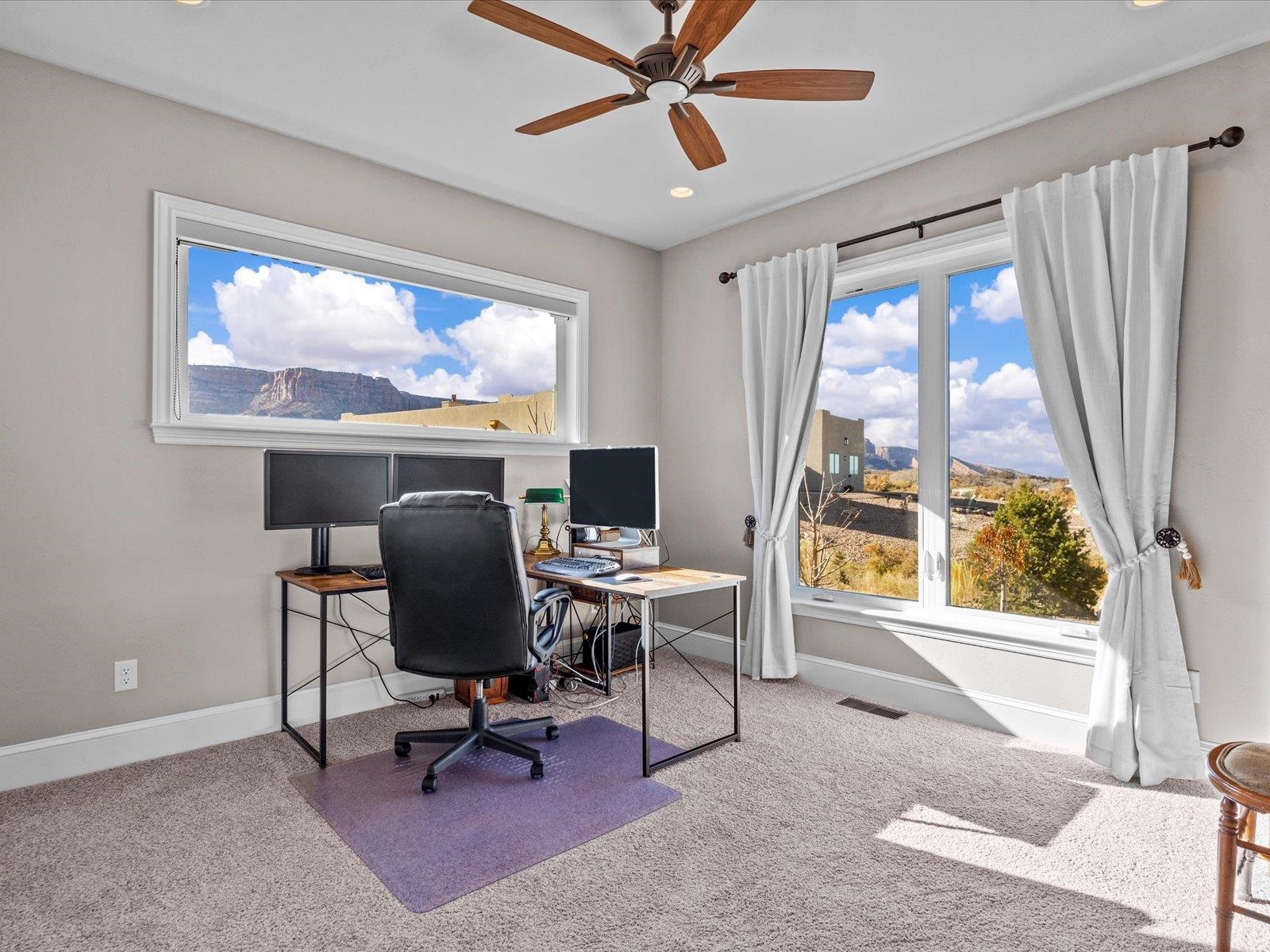 482 Riggs Way Grand Junction, CO 81507 - Photo 19 of 42 a view of a workspace with furniture and a window