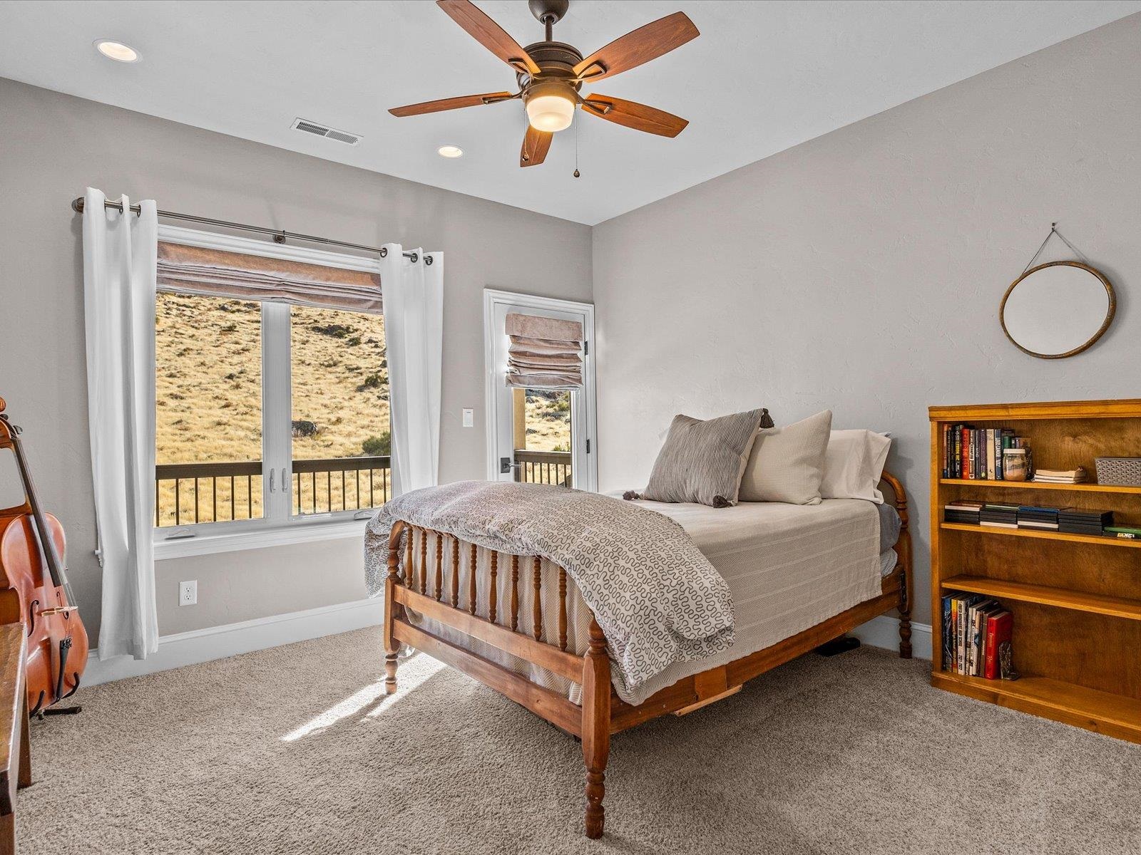 482 Riggs Way Grand Junction, CO 81507 - Photo 23 of 42 a bed room with a bed and a window