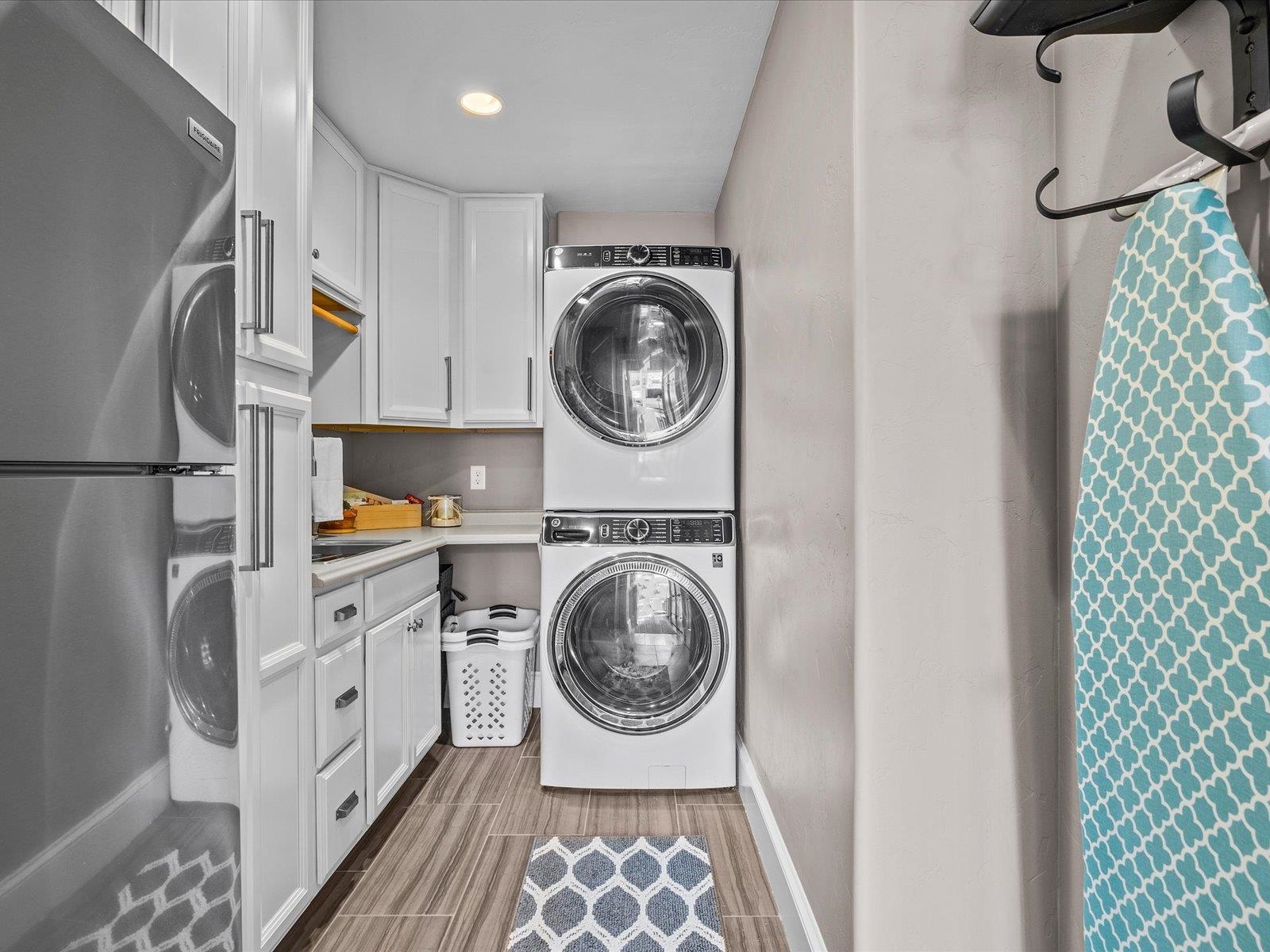 482 Riggs Way Grand Junction, CO 81507 - Photo 27 of 42 a utility room with sink dryer and washer