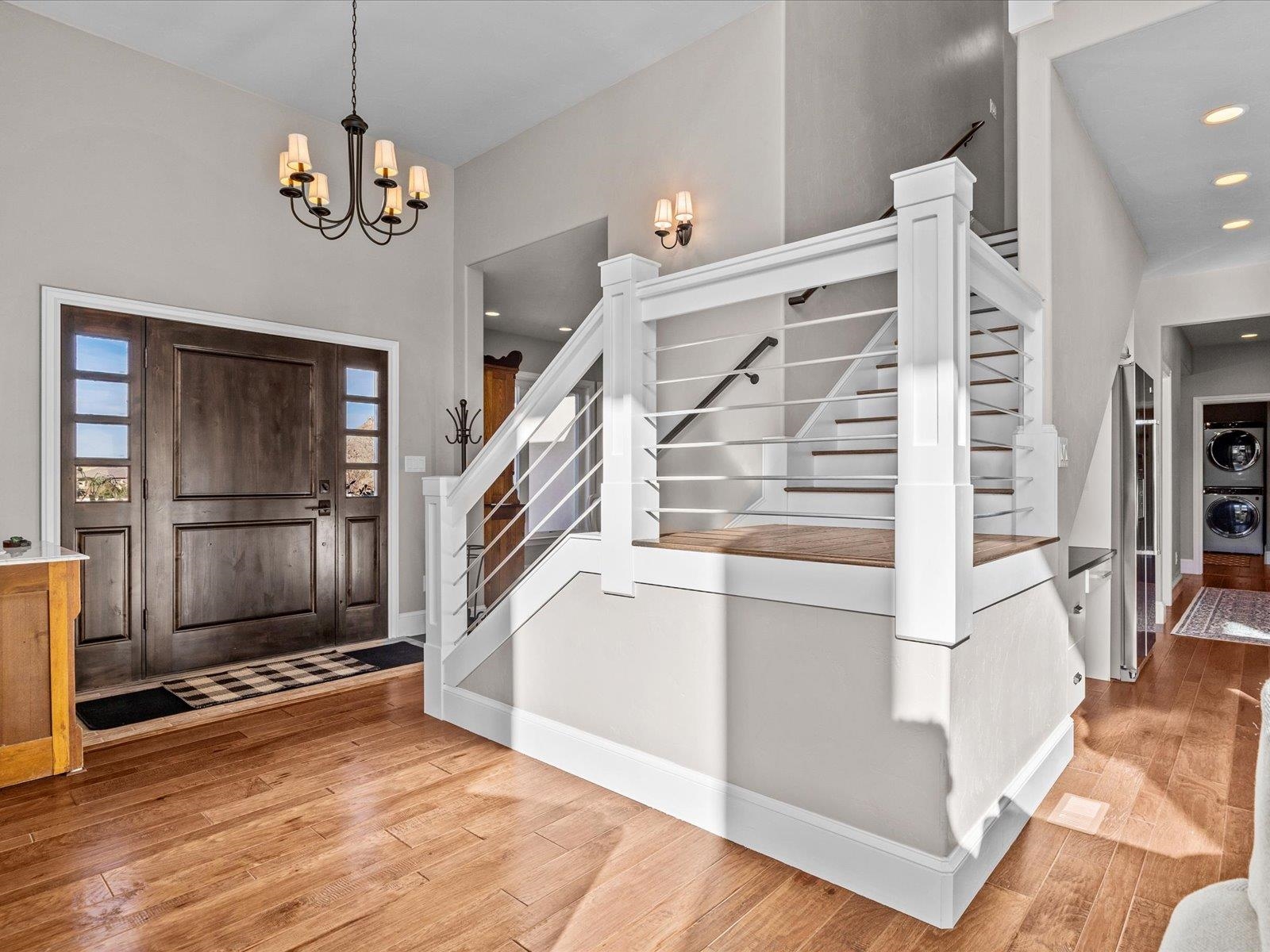 482 Riggs Way Grand Junction, CO 81507 - Photo 3 of 42 a view of entryway and hall with wooden floor