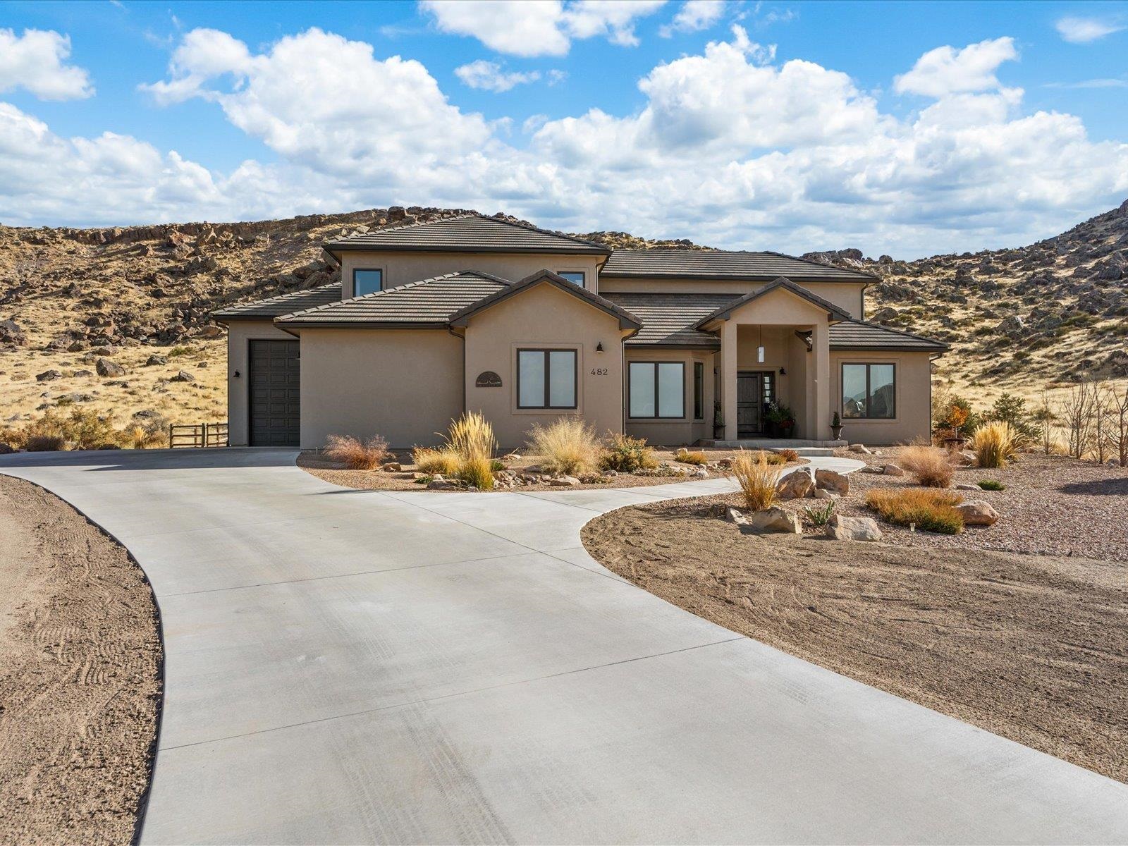 482 Riggs Way Grand Junction, CO 81507 - Photo 35 of 42 a front view of a house with cars parked