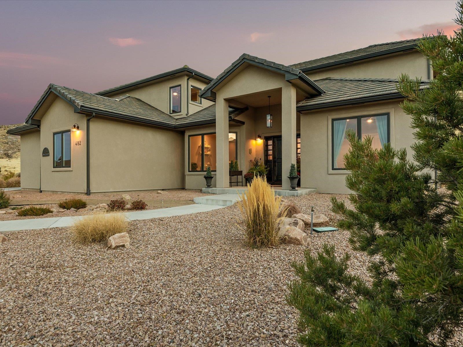 482 Riggs Way Grand Junction, CO 81507 - Photo 37 of 42 a front view of a house with garden