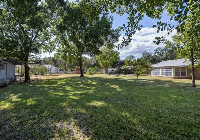 a front view of house with yard and seating area