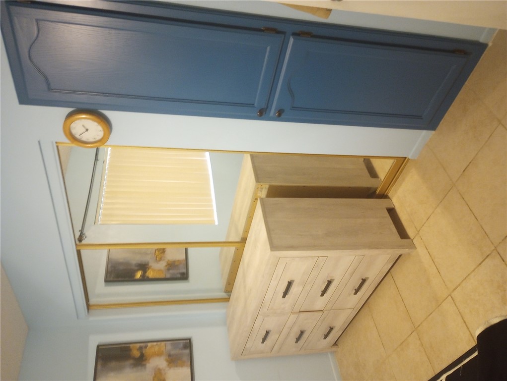 1190 Ramar Road, Unit 37 Bullhead City, AZ 86442 - Photo 8 of 14 a view of a utility room with cabinet and mirror