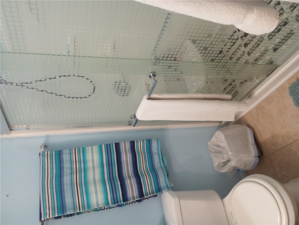 1190 Ramar Road, Unit 37 Bullhead City, AZ 86442 - Photo 10 of 14 a bathroom with a toilet and a shower