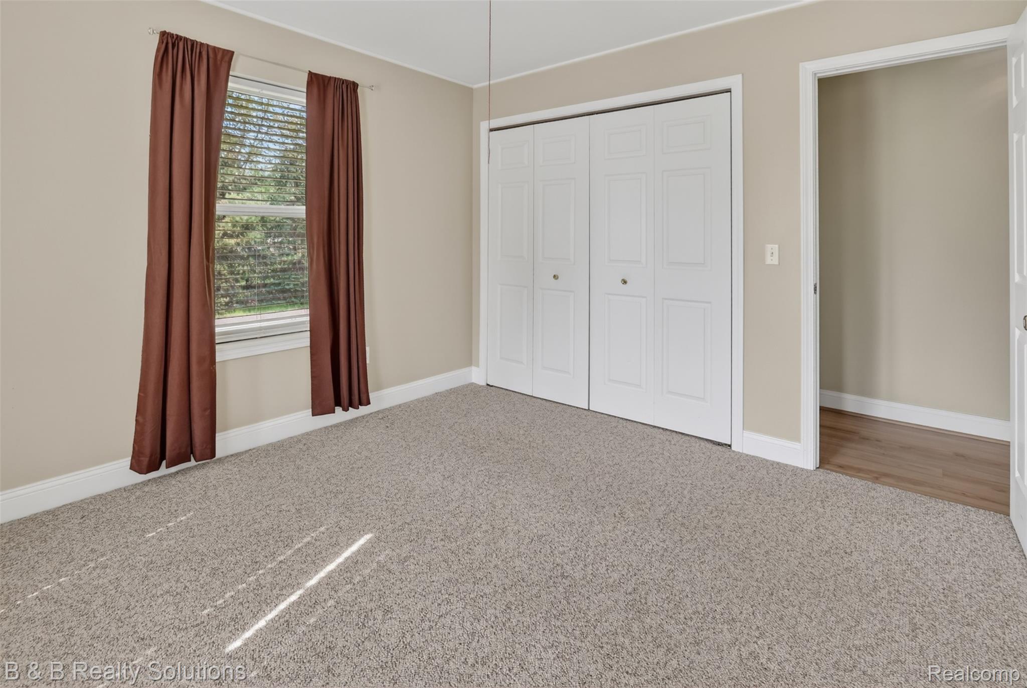 6100 Fish Lake Road North Branch, MI 48461 - Photo 24 of 45 Unfurnished bedroom with light colored carpet and a closet