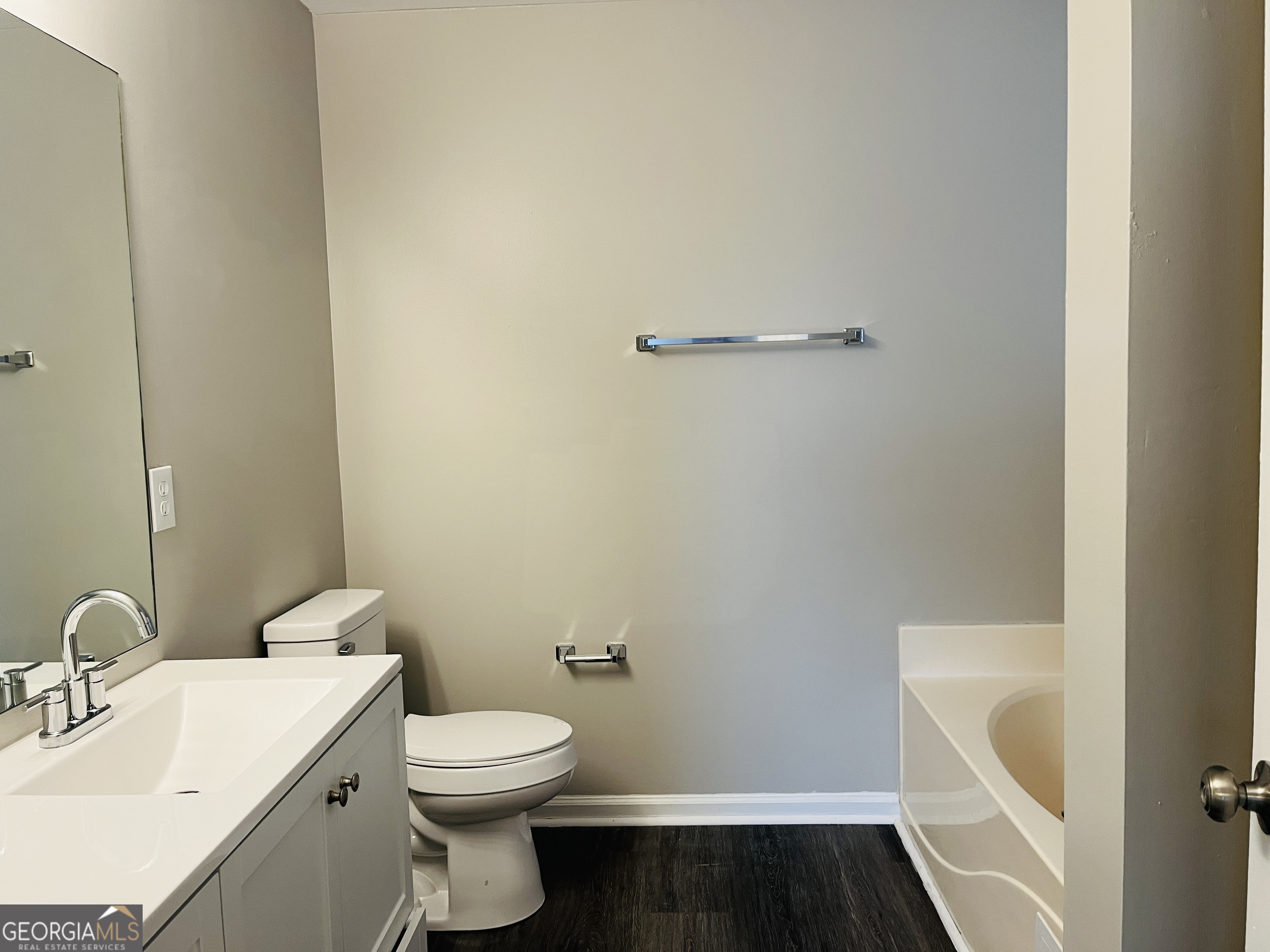 3510 Brookstone Way Union City, GA 30291 - Photo 16 of 32 a bathroom with a sink a toilet and shower