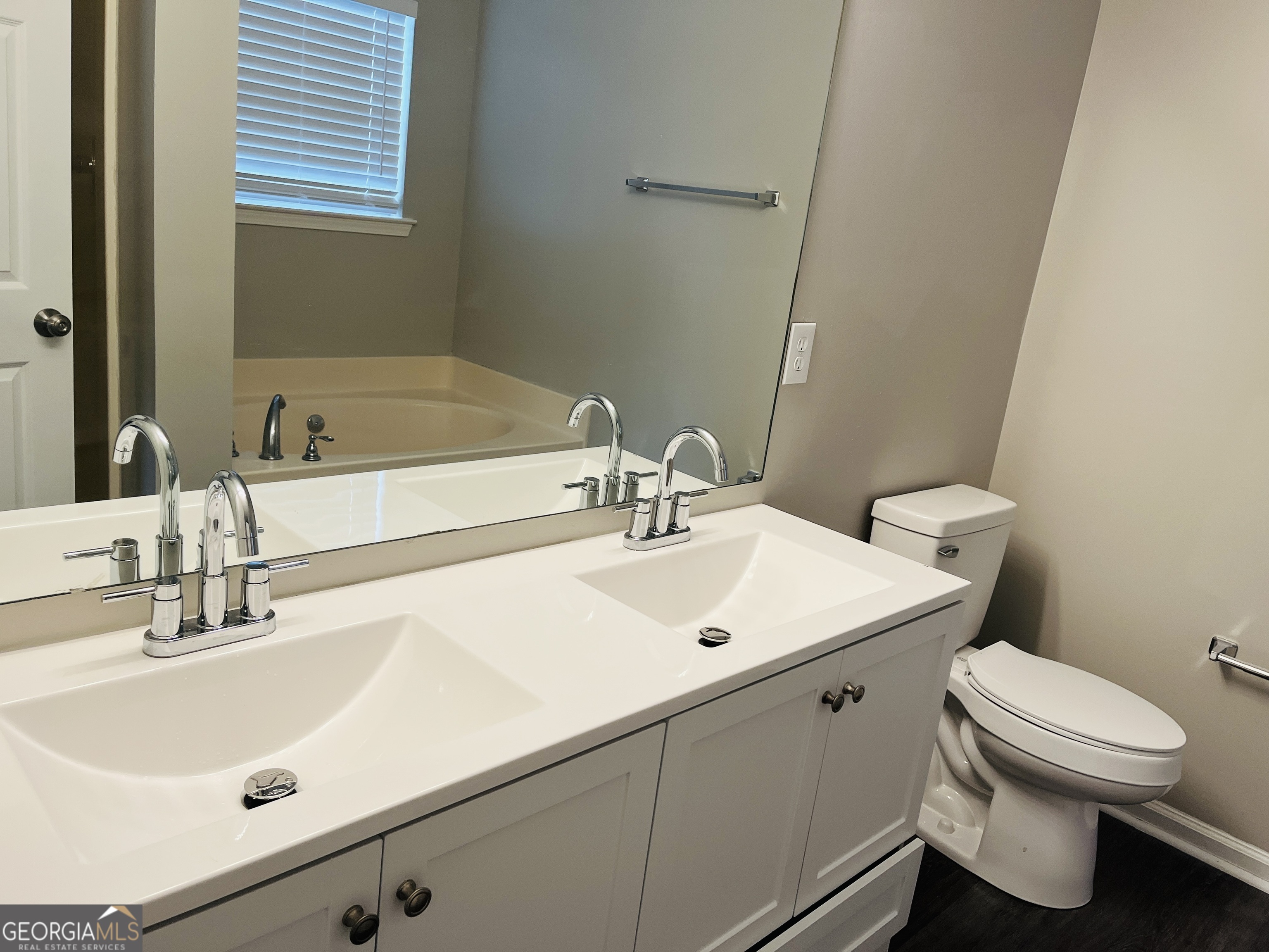 3510 Brookstone Way Union City, GA 30291 - Photo 17 of 32 a bathroom with a sink and a toilet
