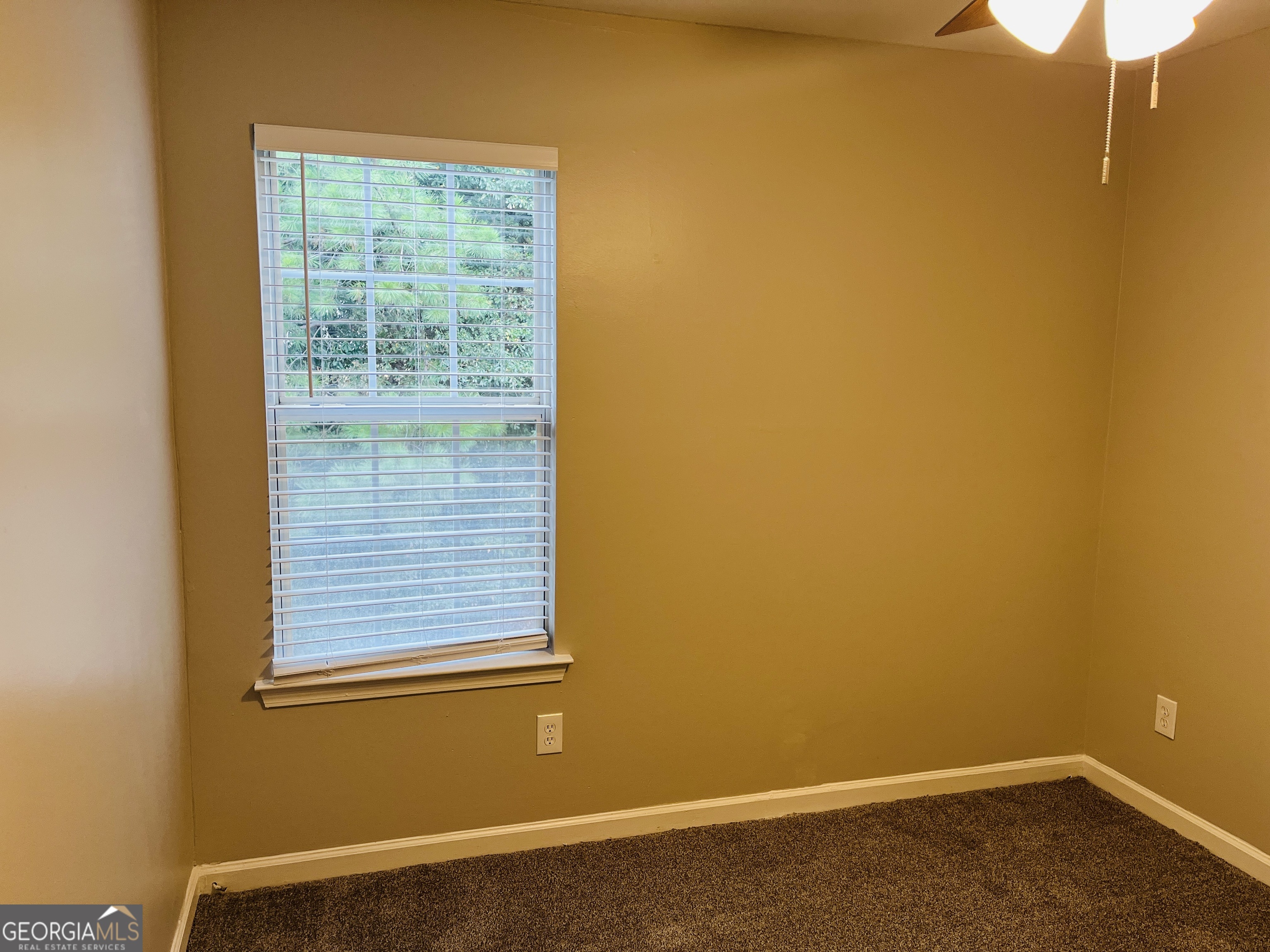 3510 Brookstone Way Union City, GA 30291 - Photo 22 of 32 a view of a small space with wooden floor and a window