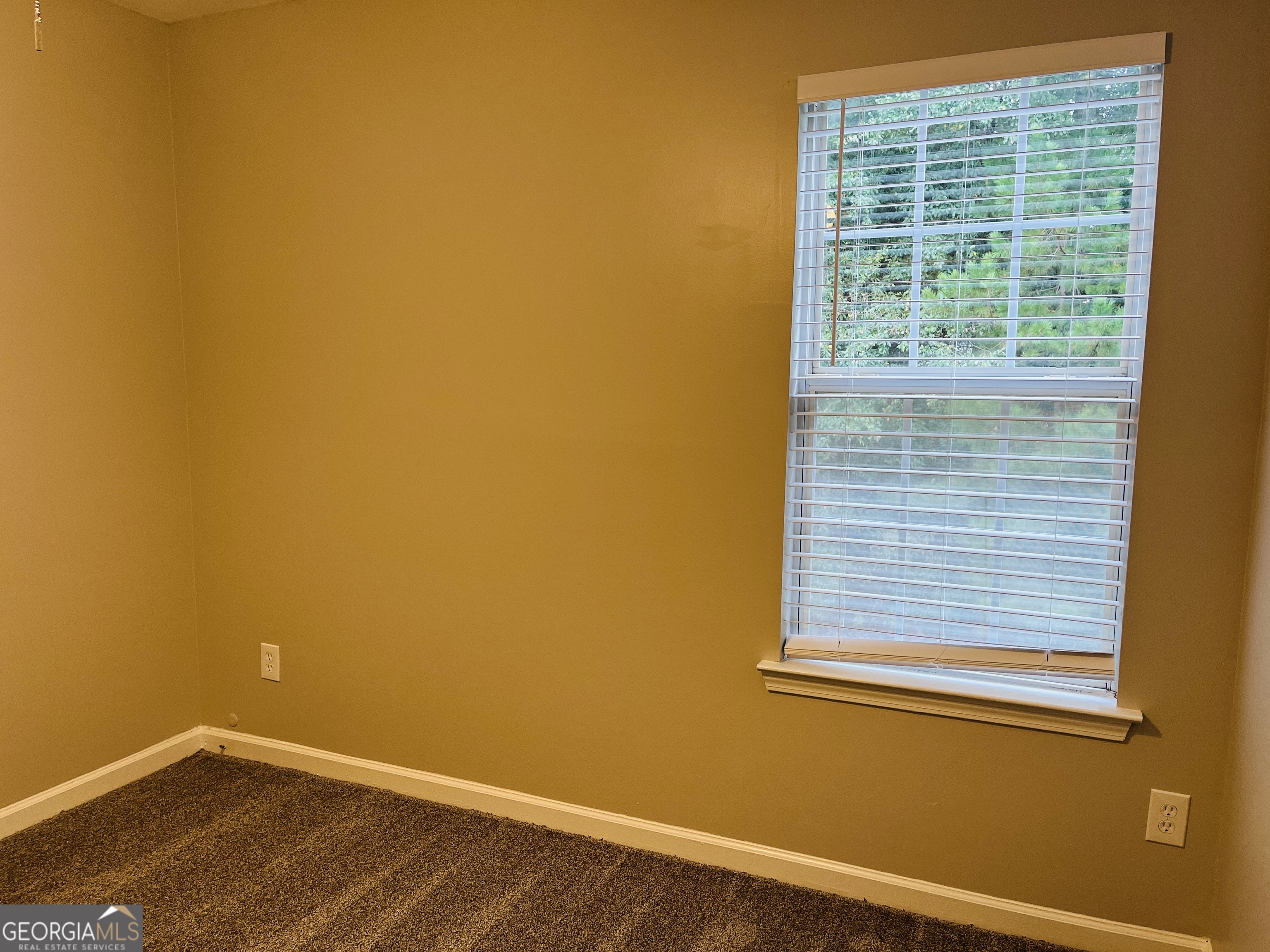 3510 Brookstone Way Union City, GA 30291 - Photo 24 of 32 a view of a small space with wooden floor and a window