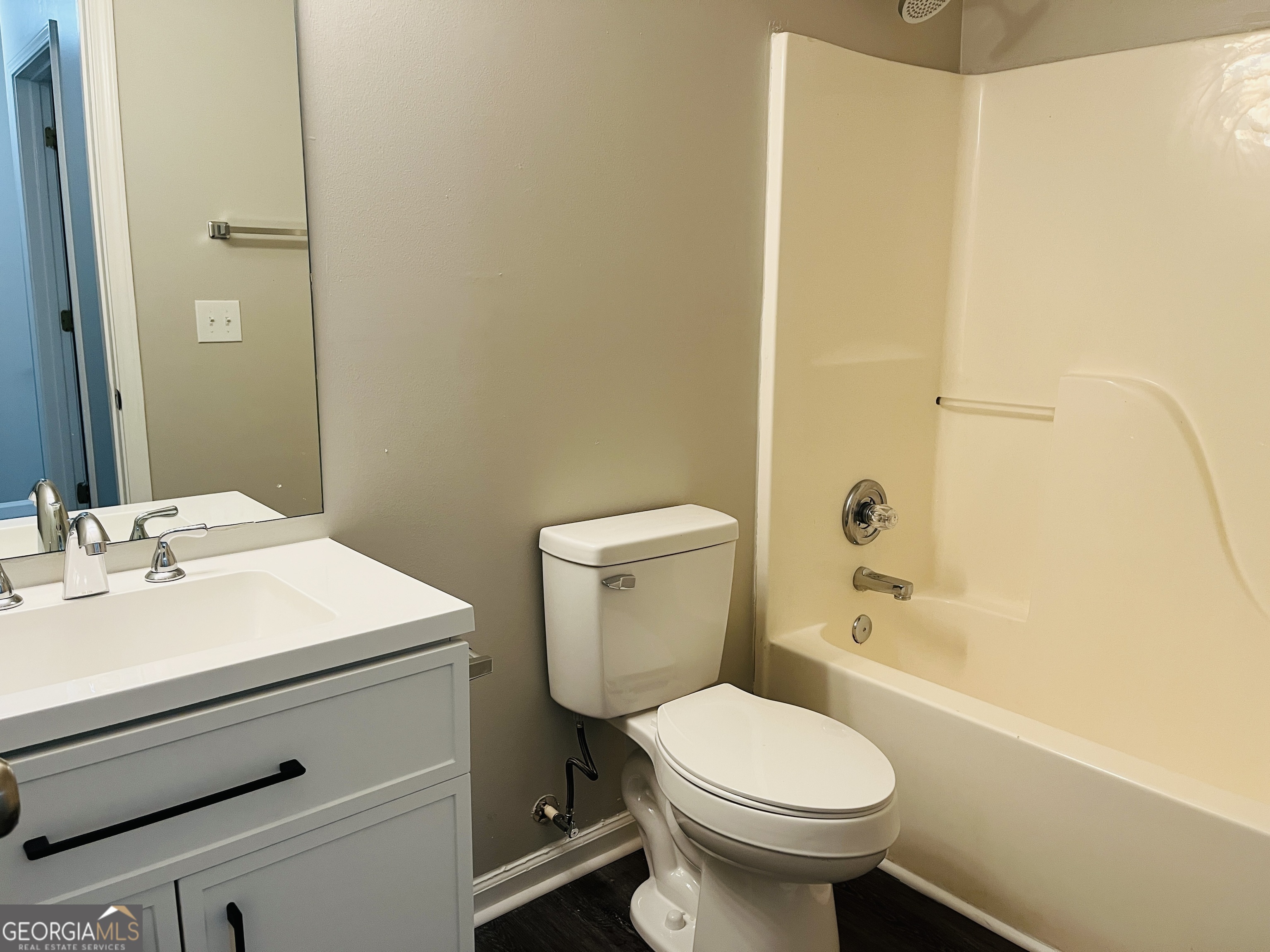 3510 Brookstone Way Union City, GA 30291 - Photo 27 of 32 a bathroom with a sink toilet and shower