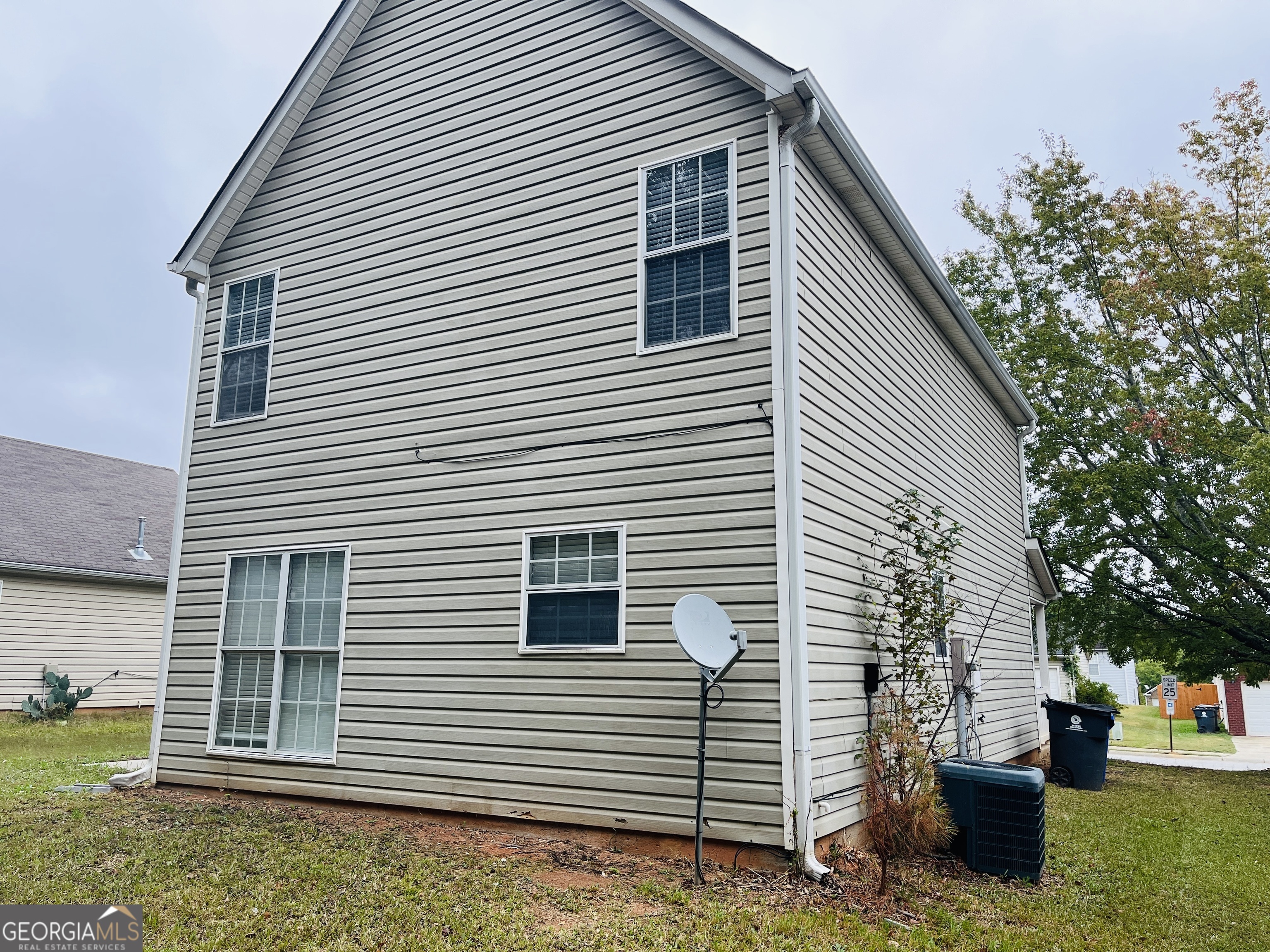 3510 Brookstone Way Union City, GA 30291 - Photo 31 of 32 a view of a house with a yard and garage