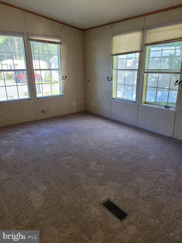 an empty room with a fireplace