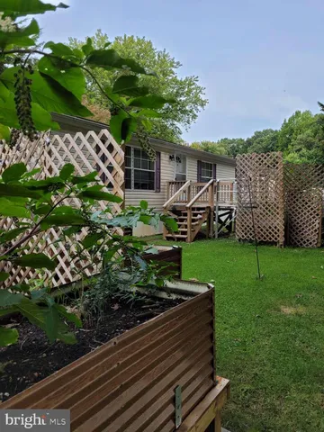 a view of a house with a back yard