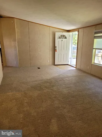 a view of an empty room with windows