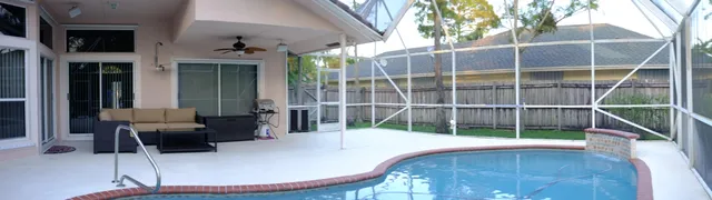 a view of a chair and tables in the balcony