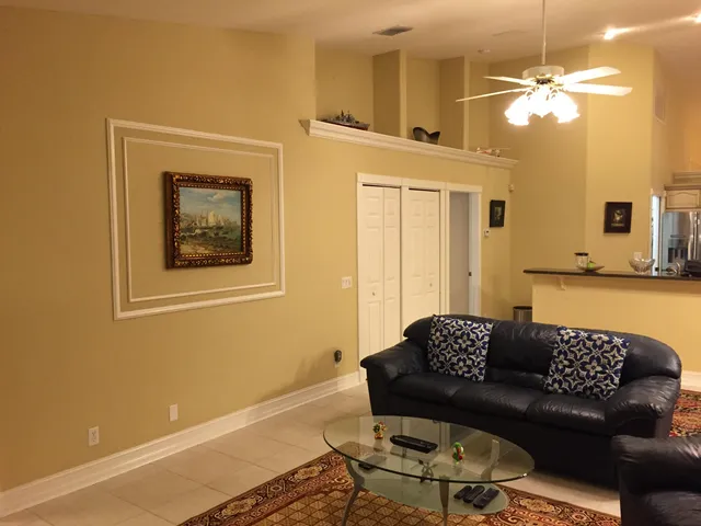 a living room with furniture and a rug