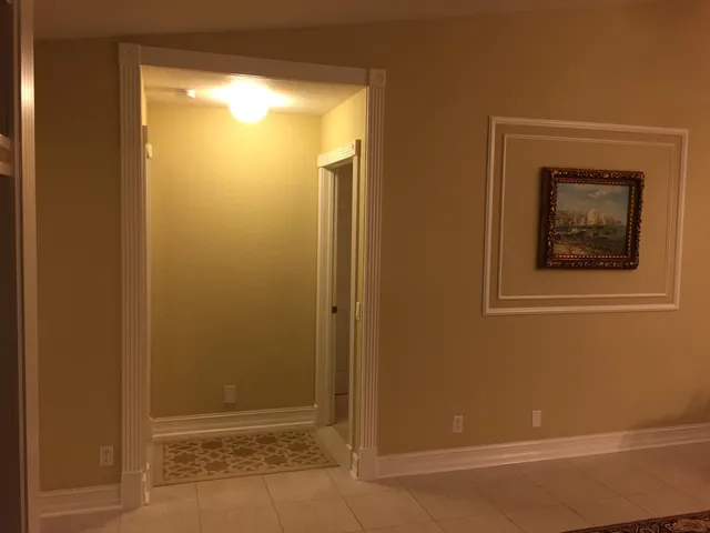 a bedroom with a bed and a mirror