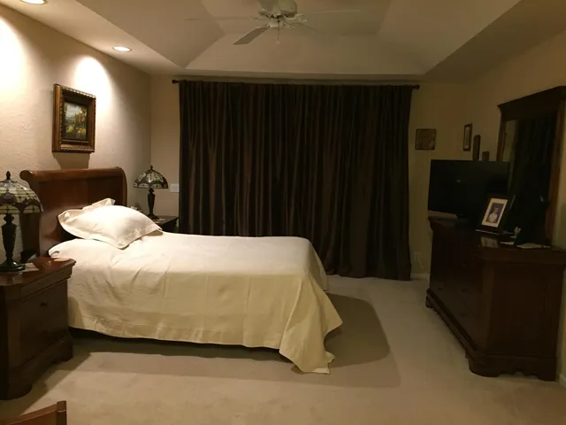 a bathroom with a tub and a glass door