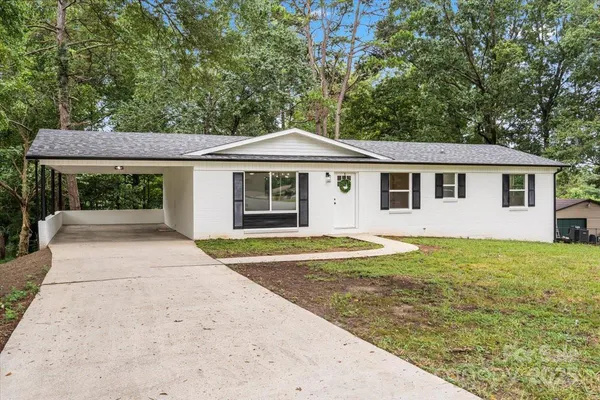 a house with trees in the background
