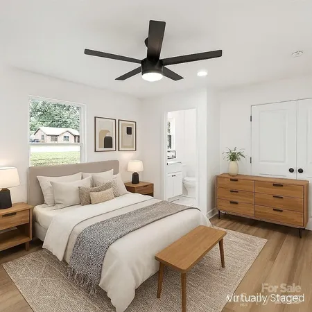 a bed room with a bed and a chandelier