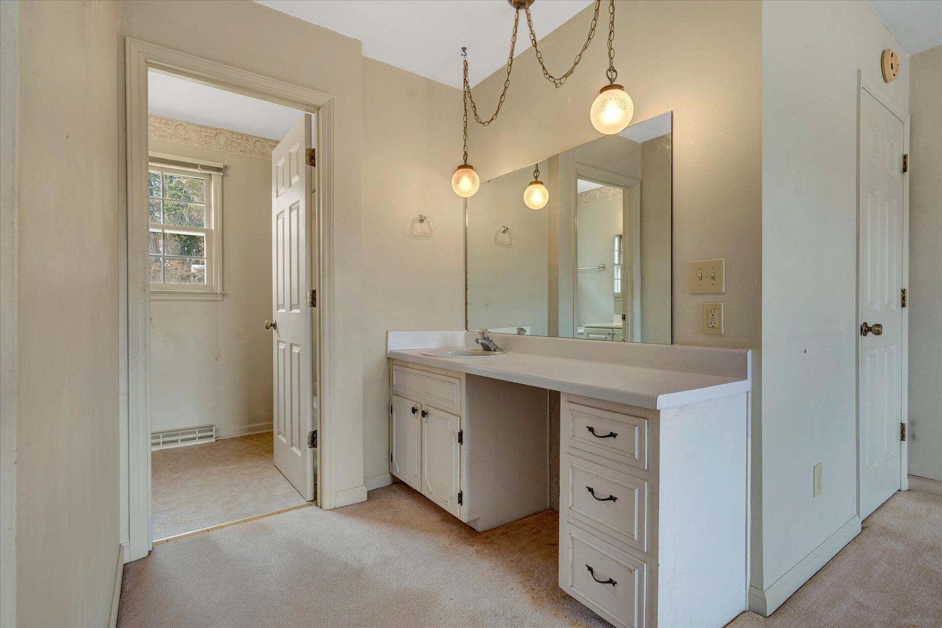 306 Ridgeview Road Blue Ridge, VA 24064 - Photo 24 of 30 a bathroom with a double vanity sink and a mirror