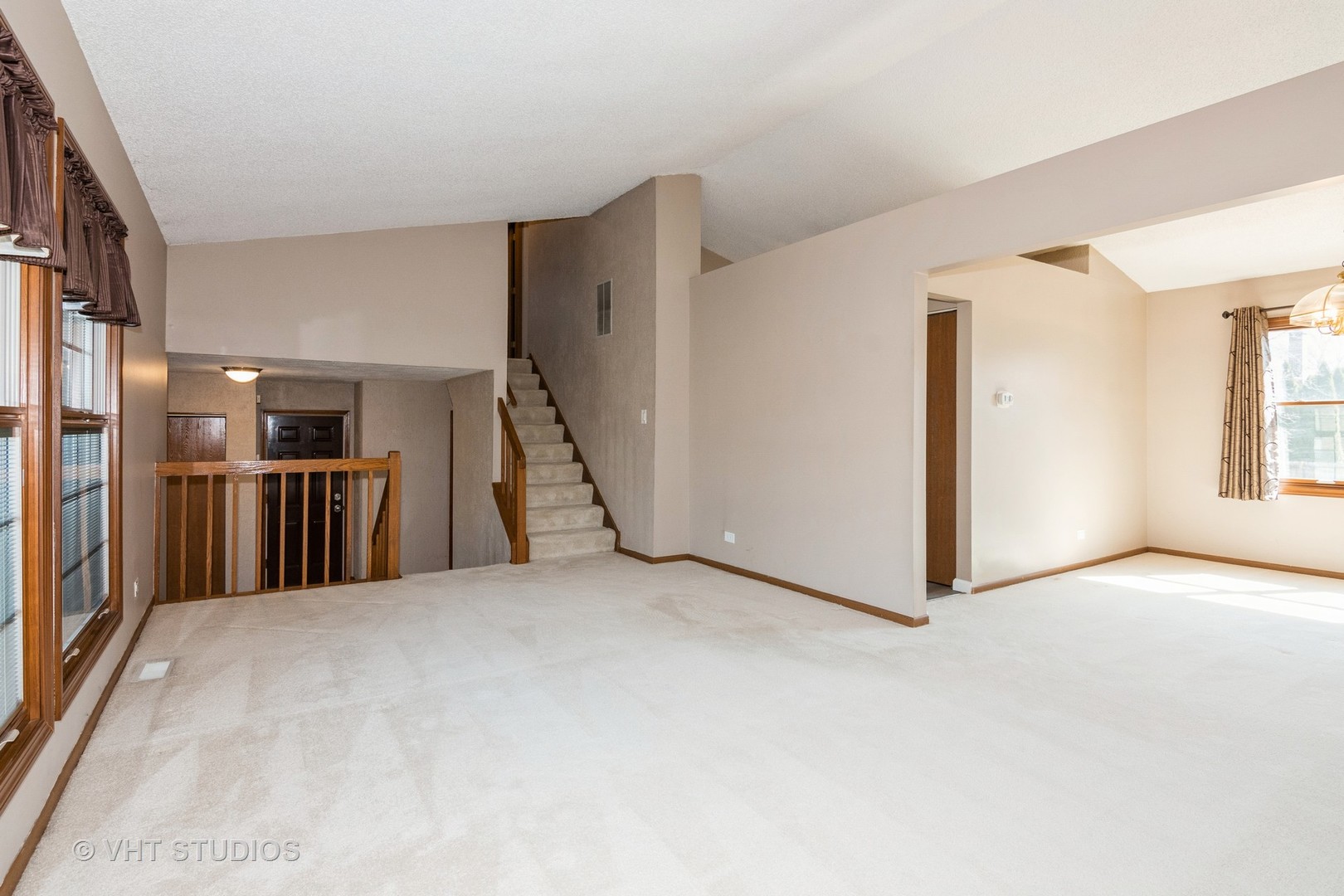 1295 Chatsworth Lane Hoffman Estates, IL 60169 - Photo 4 of 24 a view of a livingroom with a staircase