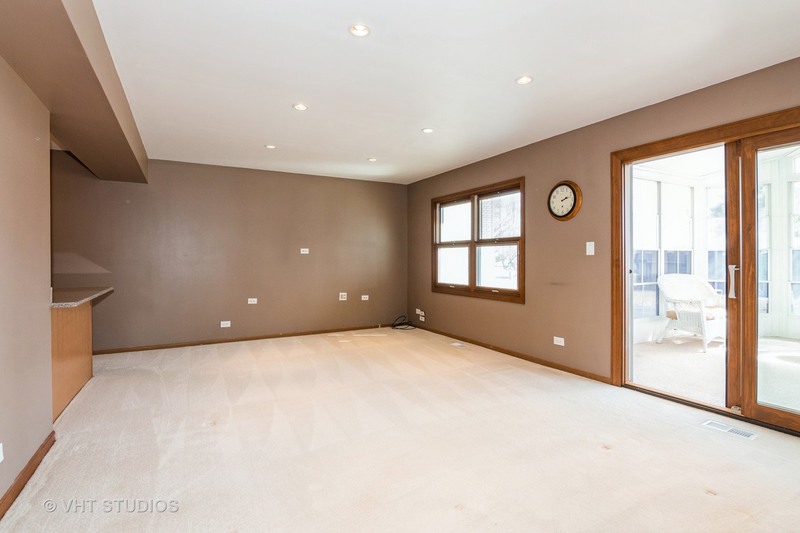 1295 Chatsworth Lane Hoffman Estates, IL 60169 - Photo 8 of 24 a view of an empty room with a window and a kitchen