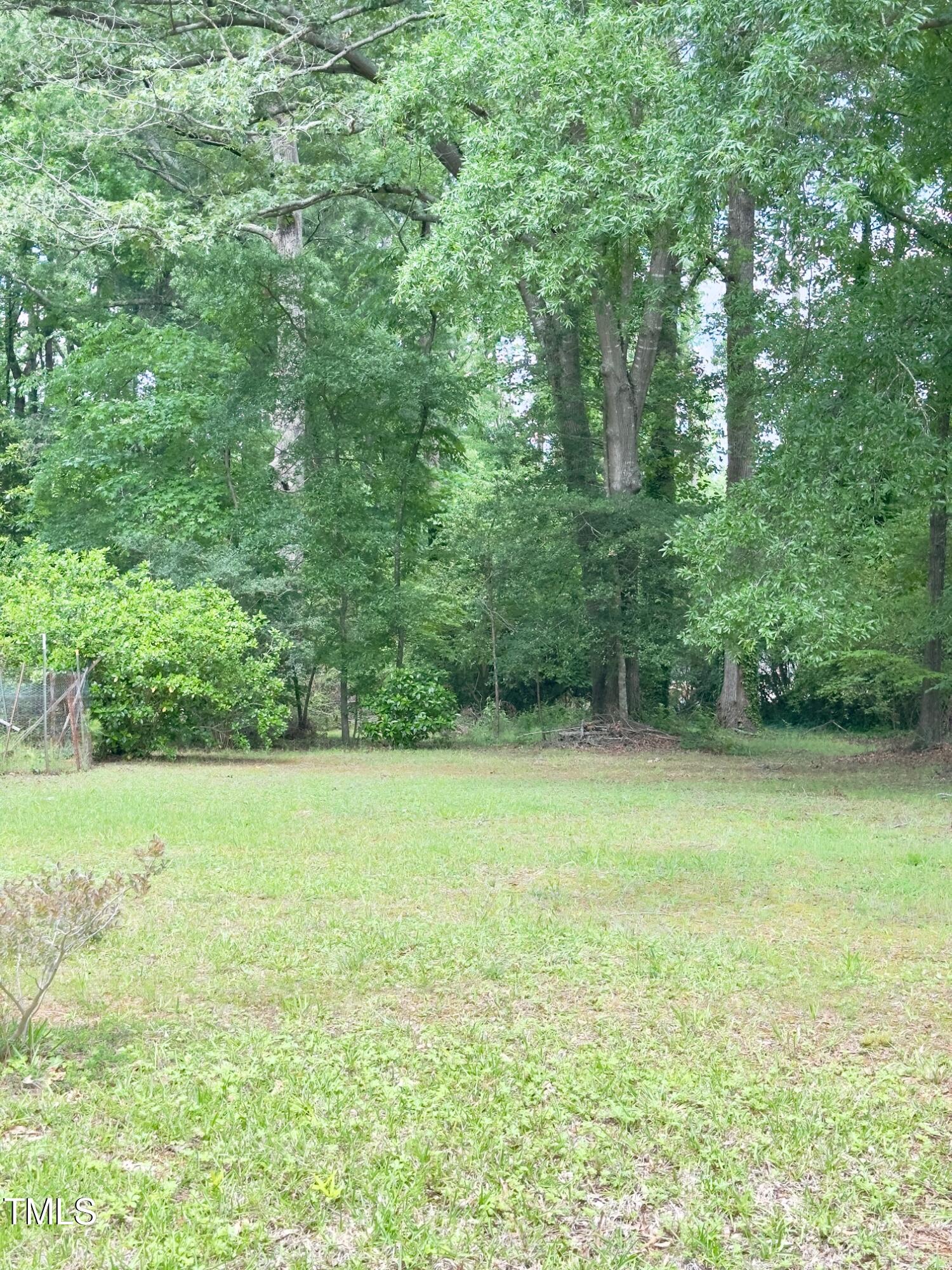 519 Sorrell Street Cary, NC 27513 - Photo 4 of 4 a view of a field with trees in the background