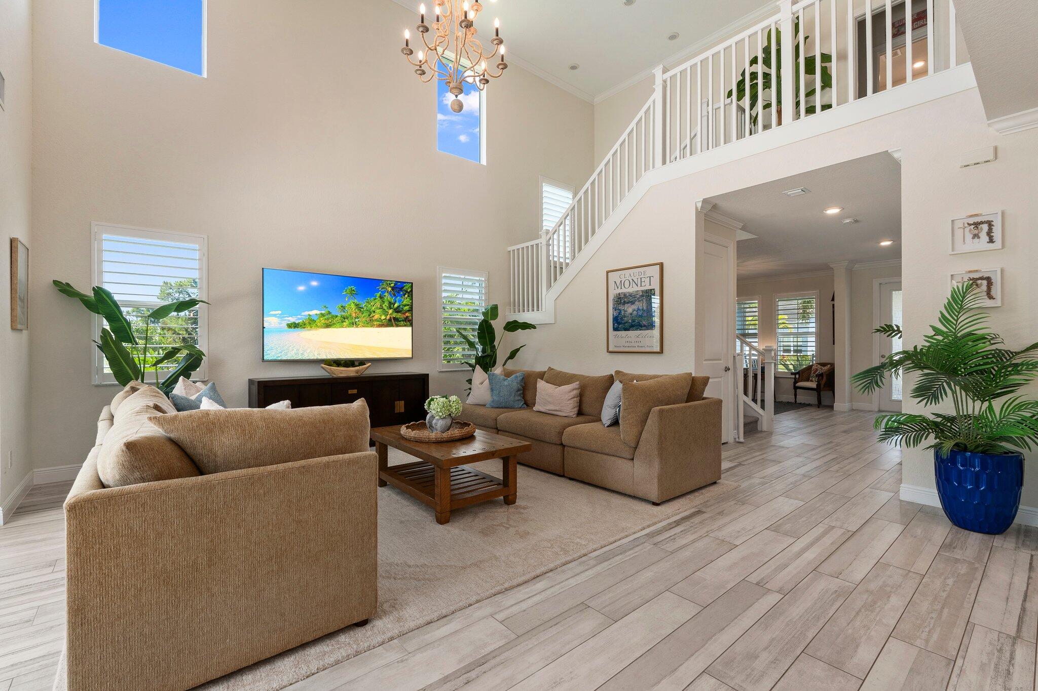 4701 Southwest Ardsley Drive Stuart, FL 34997 - Photo 14 of 83 a living room with furniture and a potted plant