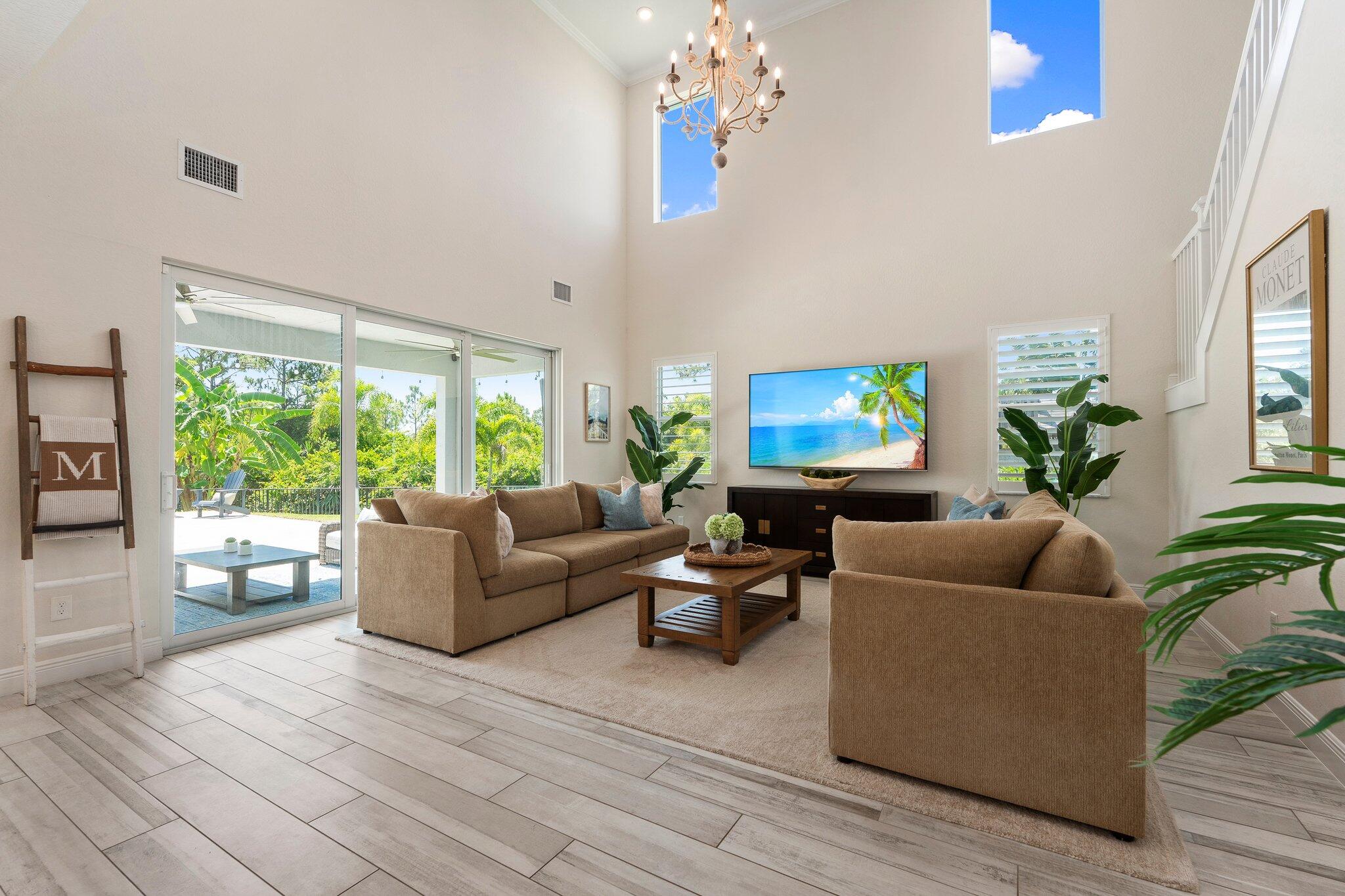 4701 Southwest Ardsley Drive Stuart, FL 34997 - Photo 15 of 83 a living room with furniture and a flat screen tv